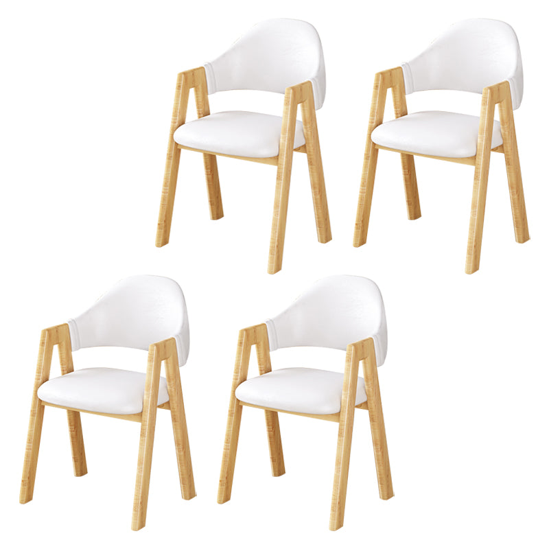 Silla de comedor tapizada escandinava con respaldo abierto y acabado mate (juego de 4)