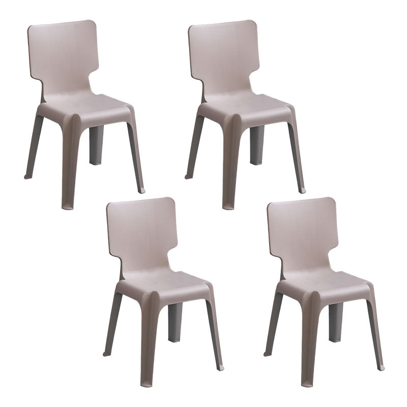 El plástico contemporáneo que cena el lado preside la silla apilable sin brazos de la parte posterior sólida