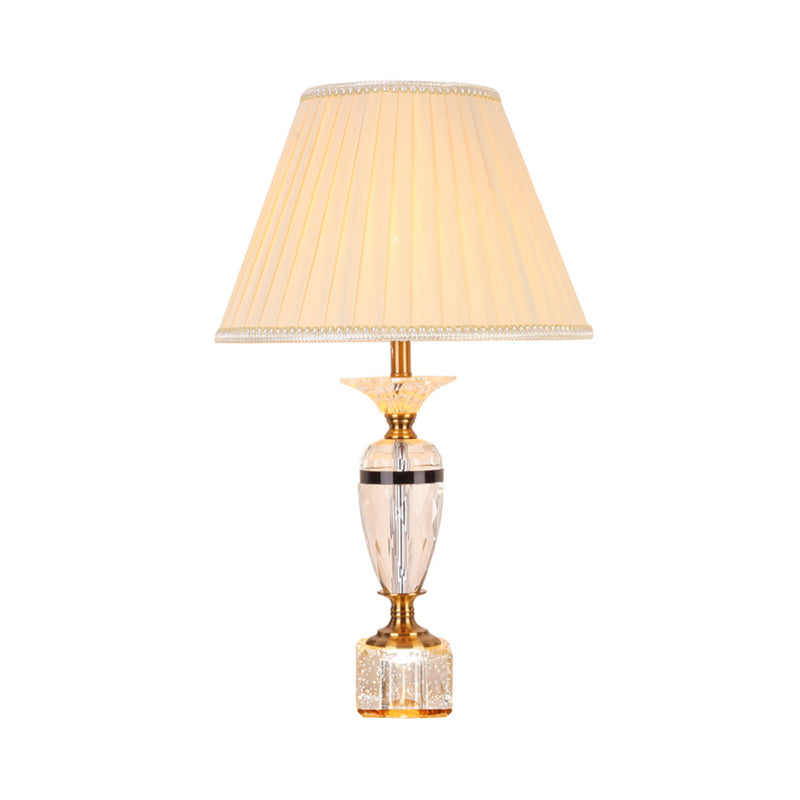 Distallo in tessuto in tessuto Urn Forma Light Modernist Crystal Faceted 1 lampada da tavolo notturno in bulbo in beige