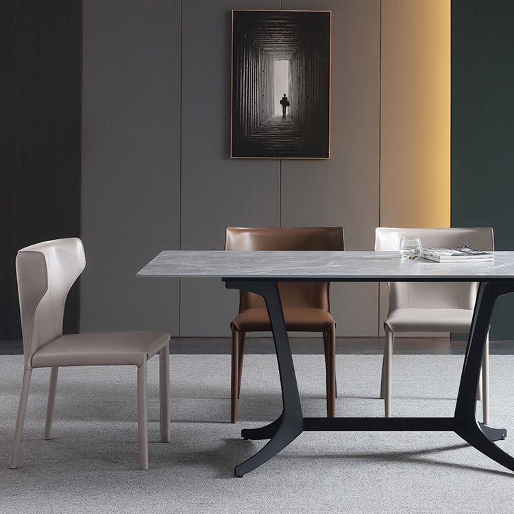 Silla lateral de comedor de cuero de estilo diseñador Silla de comedor Wingback para uso doméstico