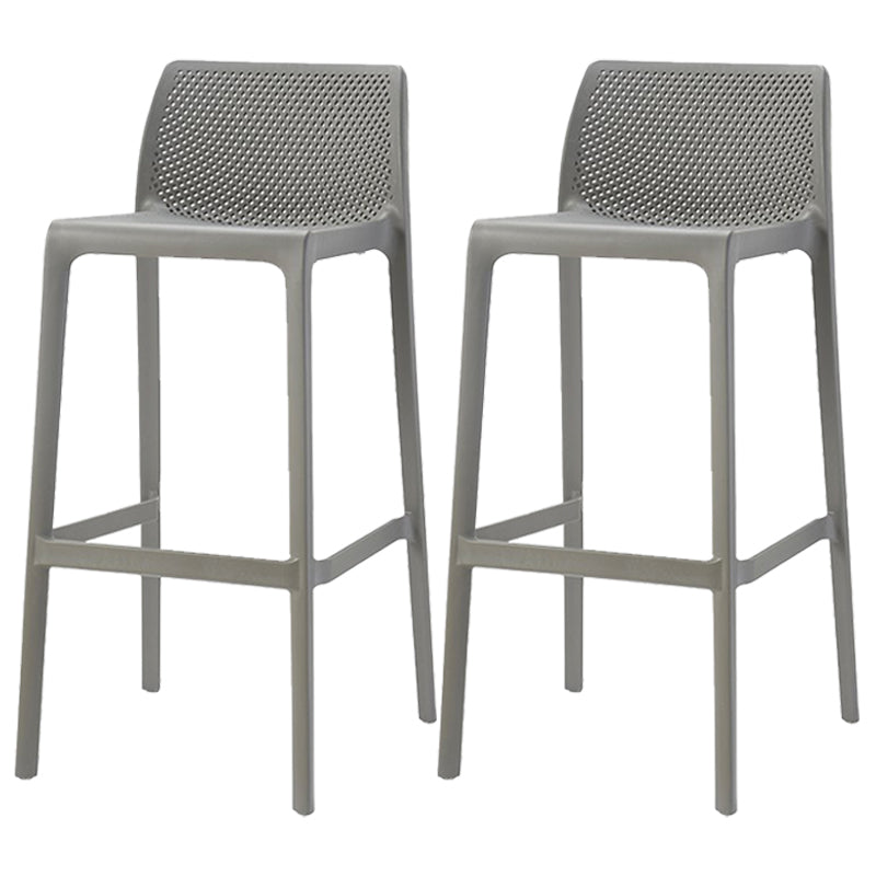 Taburetes de bar interiores apilables de plástico escandinavo con respaldo bajo