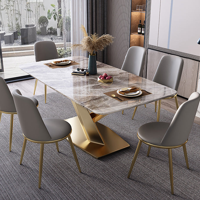 Mesa de comedor de lujo tradicional rectángulo mesa de piedra sinterizada gris con base de pedestal dorado