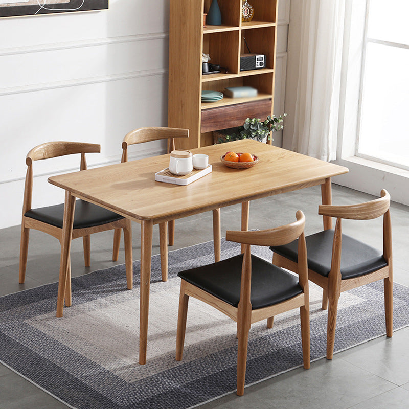 Silla lateral escandinava con respaldo abierto Silla de comedor tapizada con acabado mate