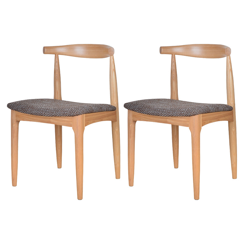 Silla lateral escandinava con respaldo abierto Silla de comedor tapizada con acabado mate