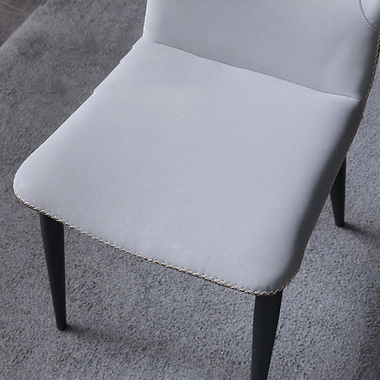 Silla lateral de cuero contemporánea para restaurante Sillas de comedor con respaldo orejero