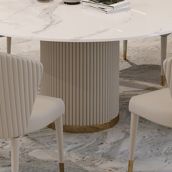 Mesa de comedor de piedra sinterizada mesa redonda de lujo con pedestal de metal en blanco