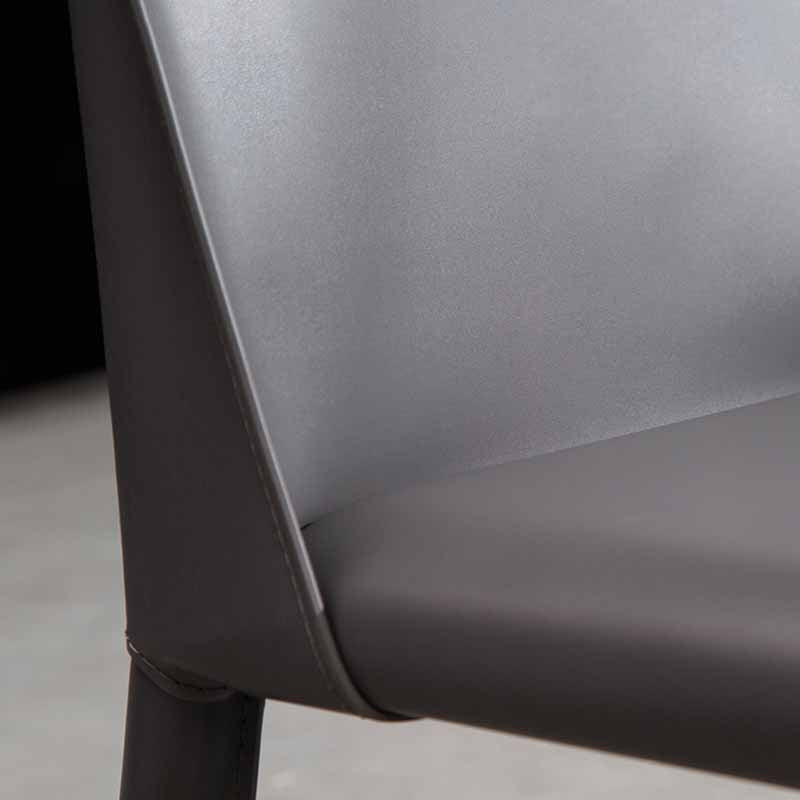 Silla de comedor de cuero de silla de montar con respaldo sólido de restaurante estilo diseñador
