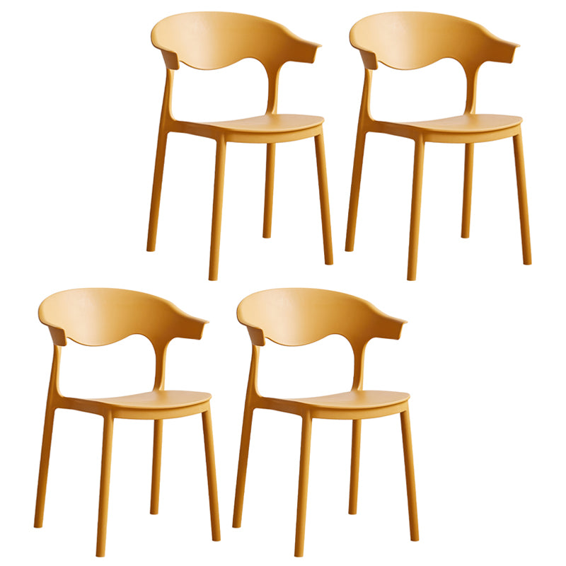 El plástico contemporáneo que cena la parte posterior abierta apilable de las sillas sin brazos cena la silla lateral