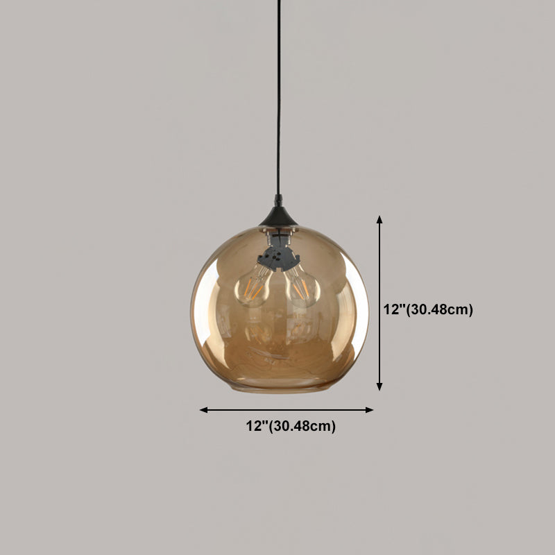 Laut de suspension industrielle géométrique à 1 lumière en verre ambre.