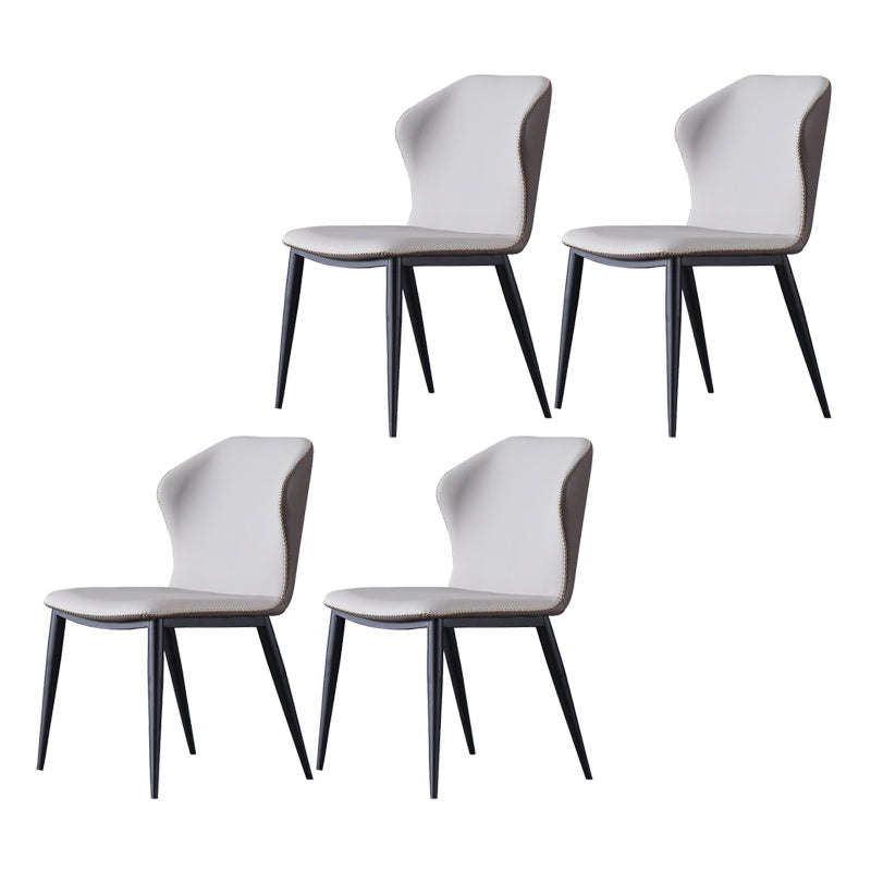 El lado sin brazos del diseño contemporáneo preside el cuero que cena la silla lateral