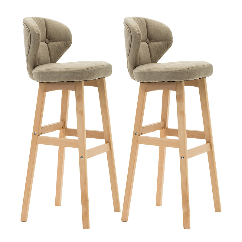 Taburete de bar de estilo escandinavo con respaldo bajo y patas de madera para restaurante y bar