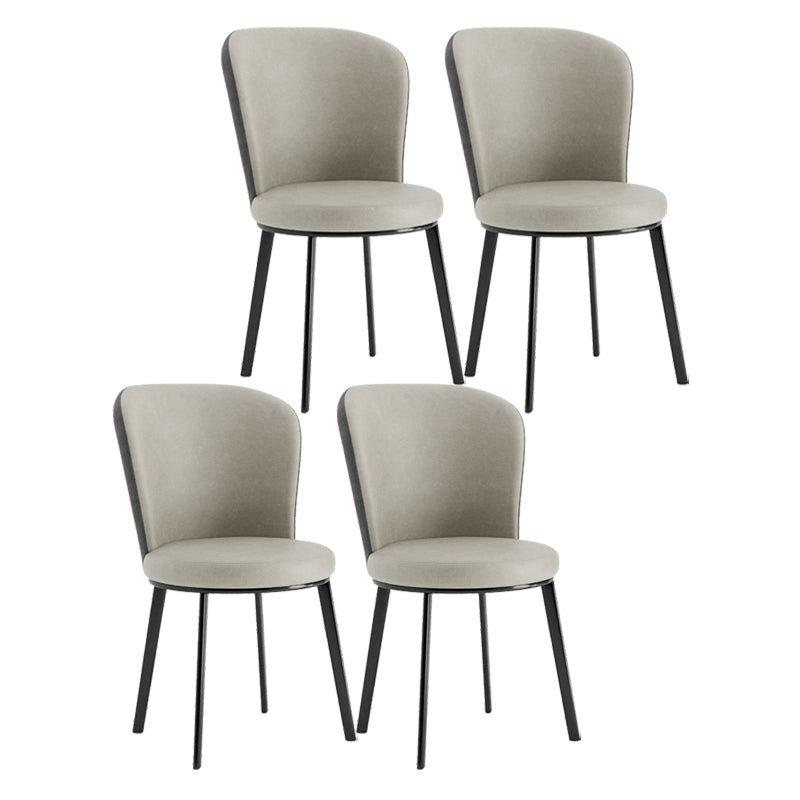El lado contemporáneo del comedor preside la silla curvada de cuero mate de Parsons