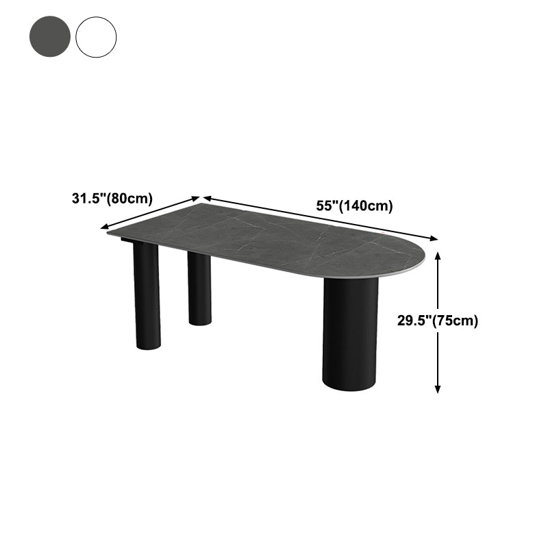 Tavolo da pranzo moderno con piano in pietra e base in acciaio nero