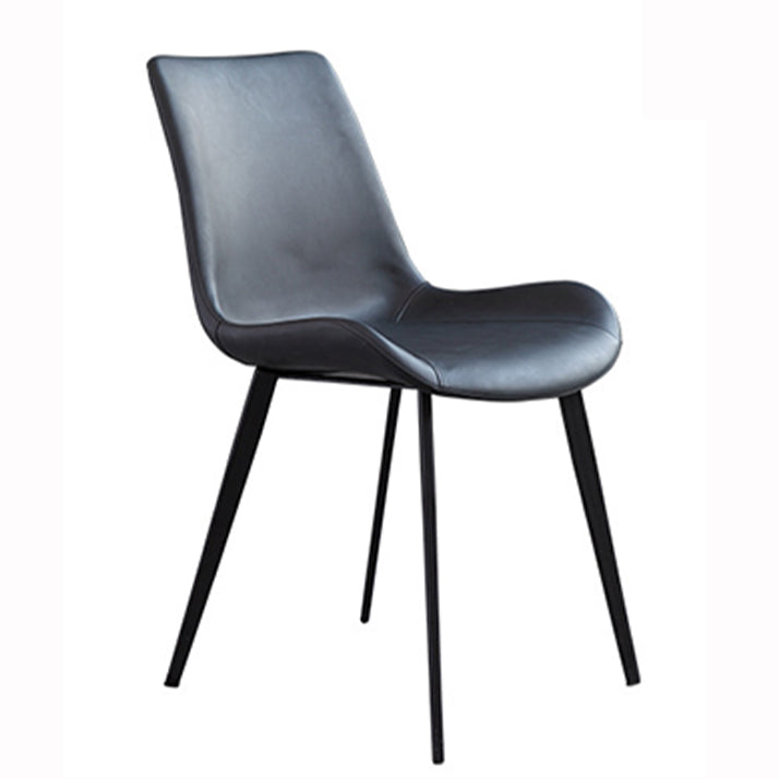El comedor contemporáneo preside la silla sin brazos curvada de cuero mate de Parsons