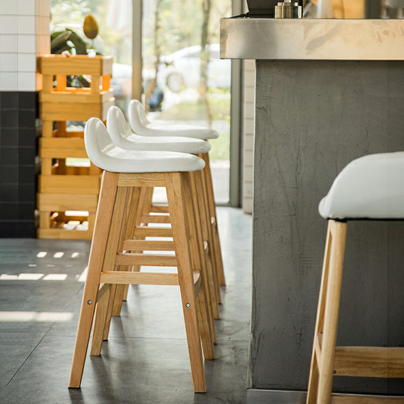 Taburete de bar interior de cuero contemporáneo de madera maciza con respaldo bajo