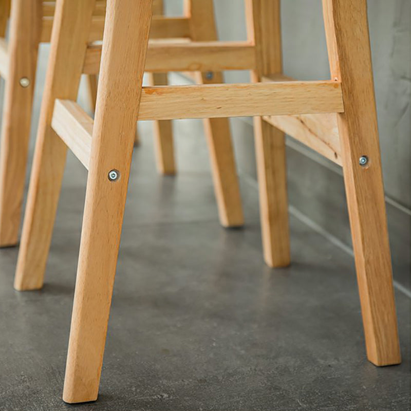 Taburete de bar interior de cuero contemporáneo de madera maciza con respaldo bajo