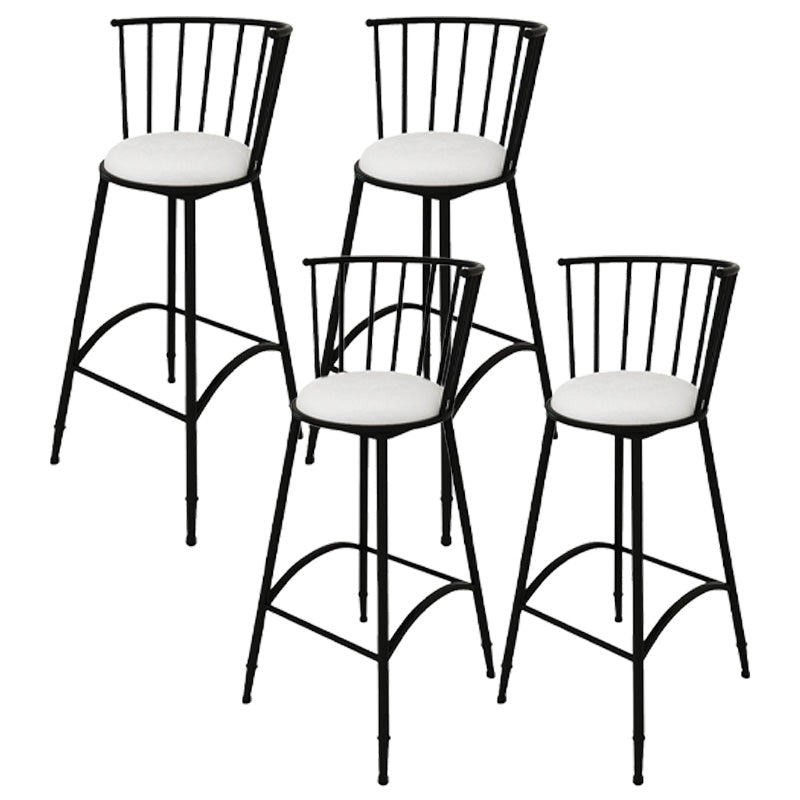 Taburete de bar redondo tapizado con respaldo y reposapiés y base de hierro