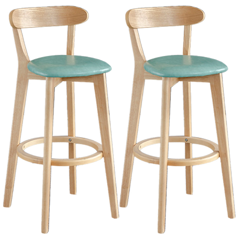 Taburete de bar estilo escandinavo con patas de madera y reposapiés con respaldo bajo para barra de cocina