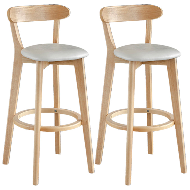 Taburete de bar estilo escandinavo con patas de madera y reposapiés con respaldo bajo para barra de cocina