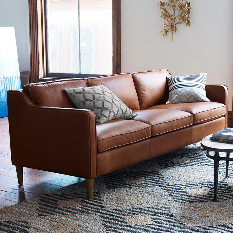 Industrial Faux Leather Loose Back Sofa with Solid Color Sloped Arms