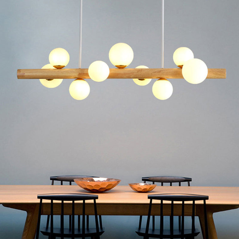 Luces colgantes de restaurantes de múltiples cabezas de madera moderna con sombra de vidrio de globo