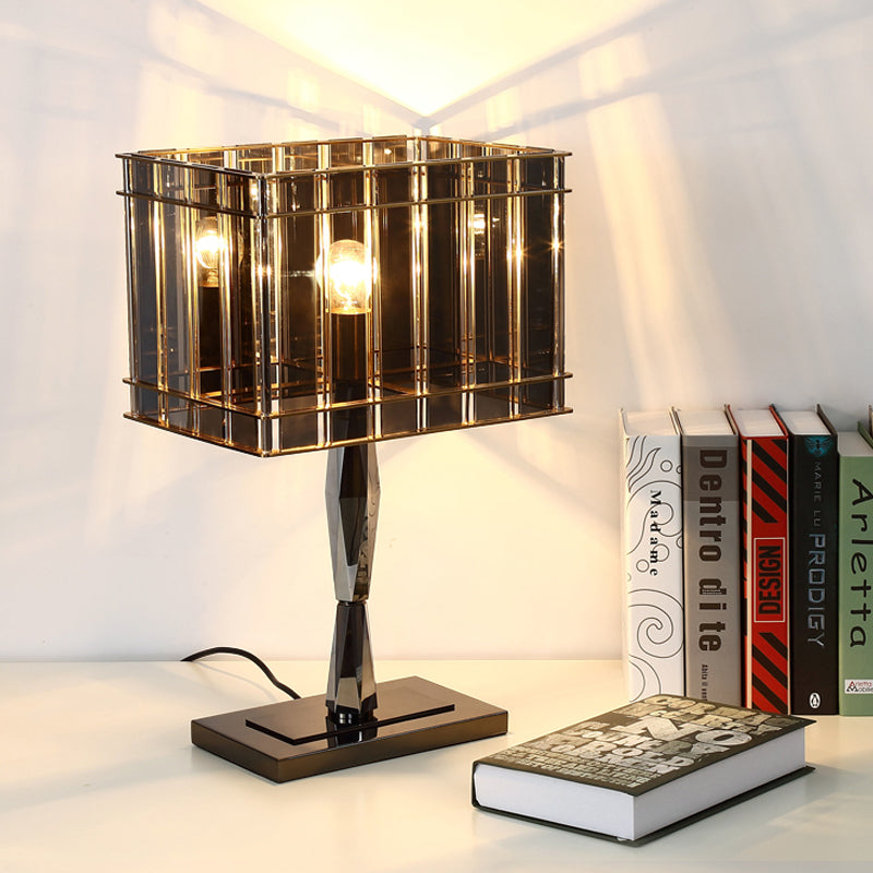 Lampada da comodino modernista rettangolare a 1 lampadina in cristallo fumé con piedistallo in metallo