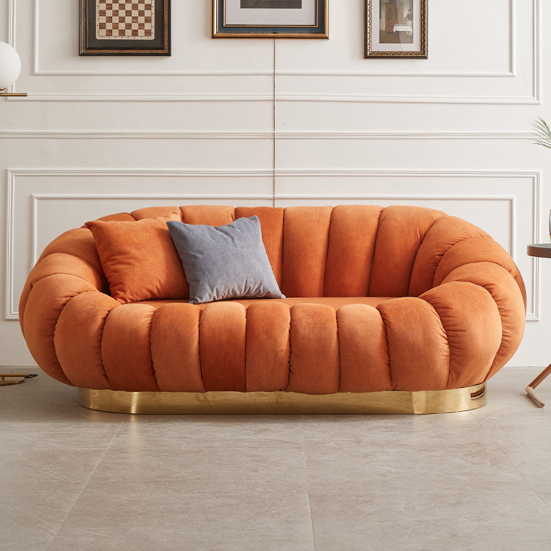 Sofa courbe de couleur unie contemporaine avec bras penchés pour le salon de la chambre