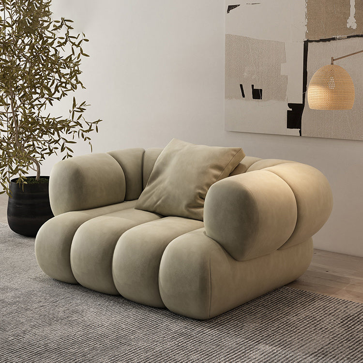 Divano verde scandinavo con braccio di smoking e cuscino cucito