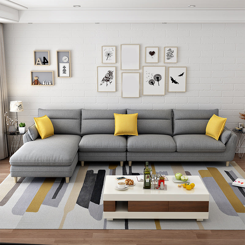 Divano in tessuto insolente e chaise da 3/4 posti cuscino.