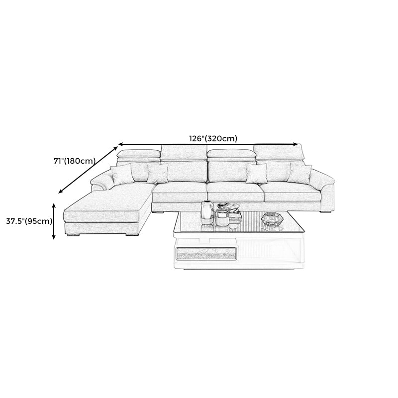 Divano a forma di L scandinava e cuscino da cuscino.