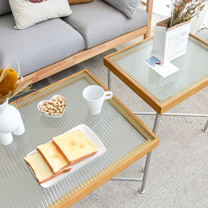 Scandinavian Glass Coffee Table with Wood Accents Cross Legs Cocktail Table