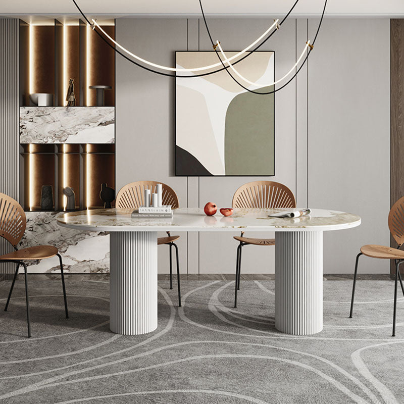 Table de salle à manger ovale moderne avec dessus en pierre et double piédestal en métal