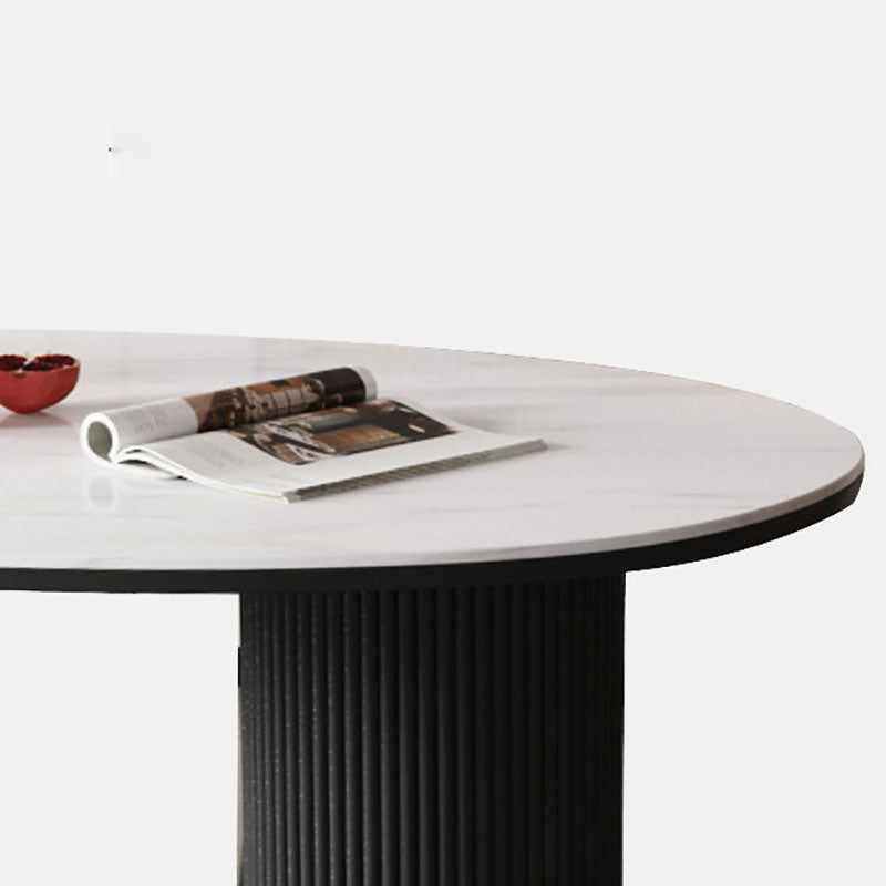 Table de salle à manger ovale moderne avec dessus en pierre et double piédestal en métal