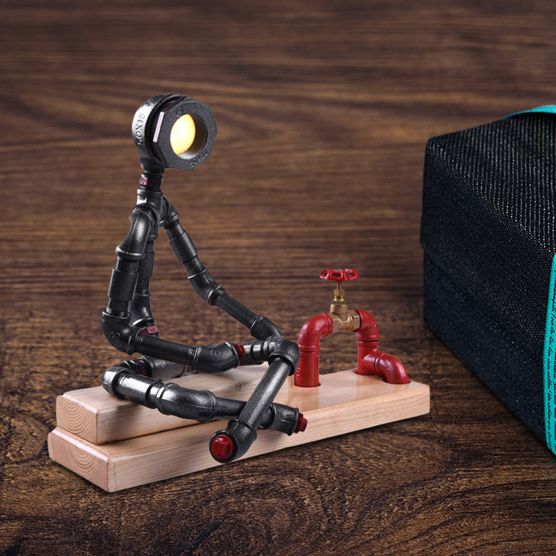 Lámpara de mesa LED Industrial con patas cruzadas de hierro para dormitorio, lámpara de noche en negro con válvula decorativa y base de madera rectangular