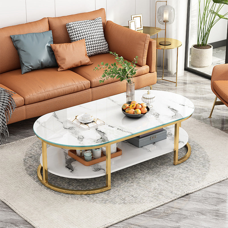 Contemporary Oval Glass Top Cocktail Table with Golden Base and Shelf