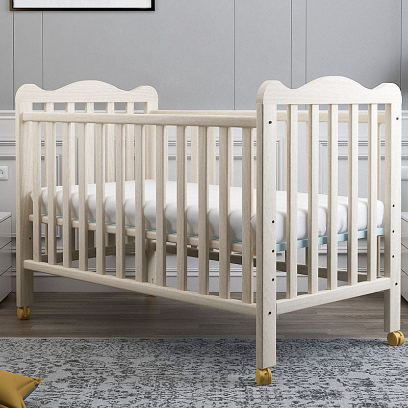 Scandinavian Wood Baby Crib Pine with Guardrail Nursery Crib with Wheels
