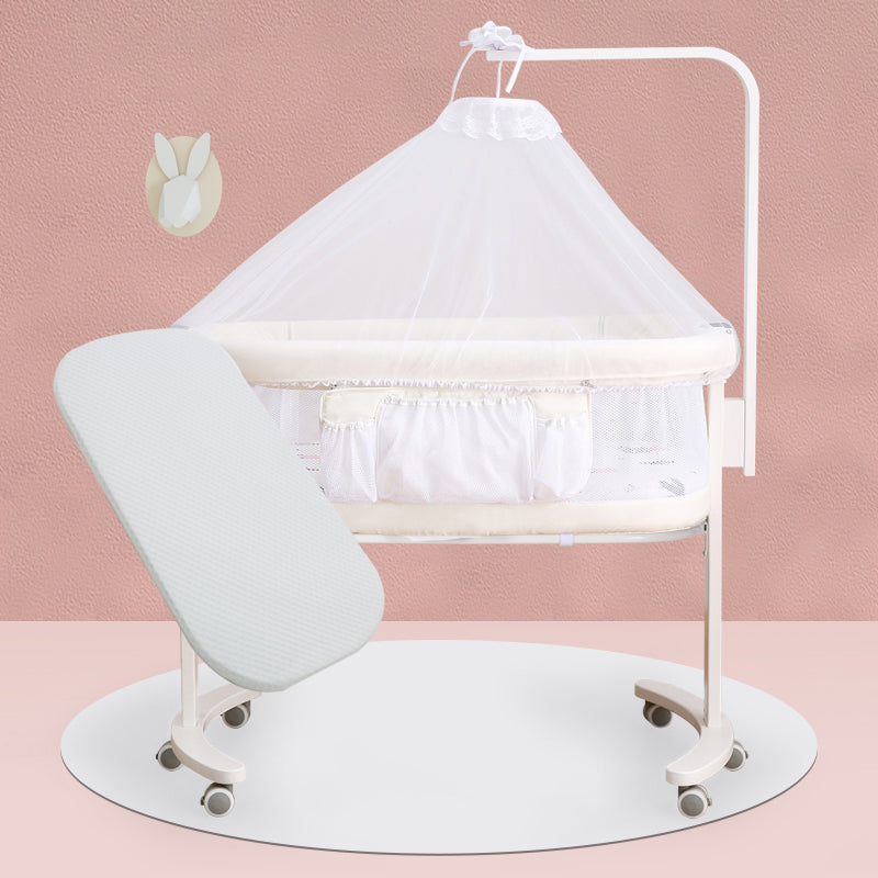 Modern Rocking Crib Cradle Metal Oval Bedside Bassinet with 4 Wheels