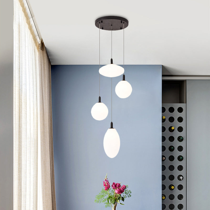 Gold/Black Ball and Oval Cluster Pendant Minimalism 4 Lights Cream Glass Hanging Lamp with Round Canopy