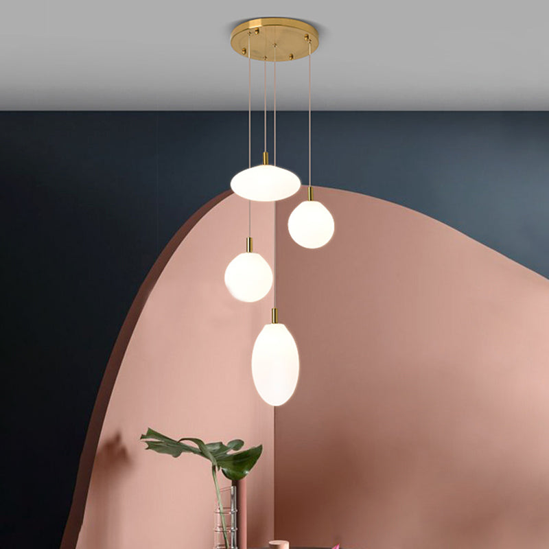 Gold/Black Ball and Oval Cluster Pendant Minimalism 4 Lights Cream Glass Hanging Lamp with Round Canopy