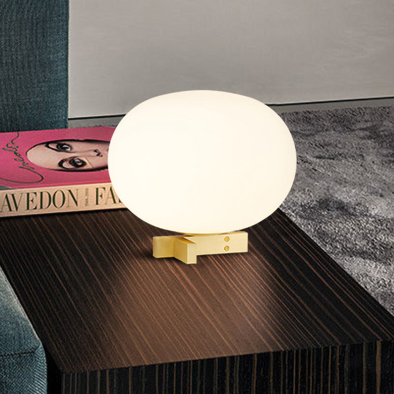 Lampada da notte postmoderna a forma di uovo in vetro color crema Lampada da comodino con finitura oro a 1 luce per comodino