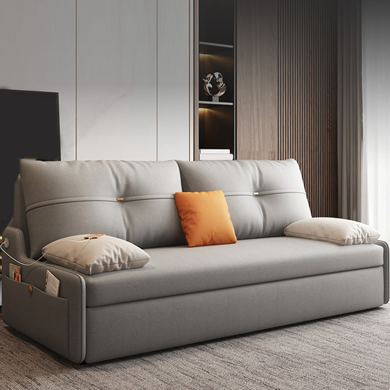Glam Grey Futon Sleeper Sofa with Tufted Back and Storage in Faux Leather