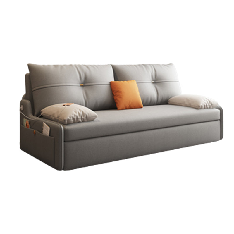 Glam Grey Futon Sleeper Sofa with Tufted Back and Storage in Faux Leather