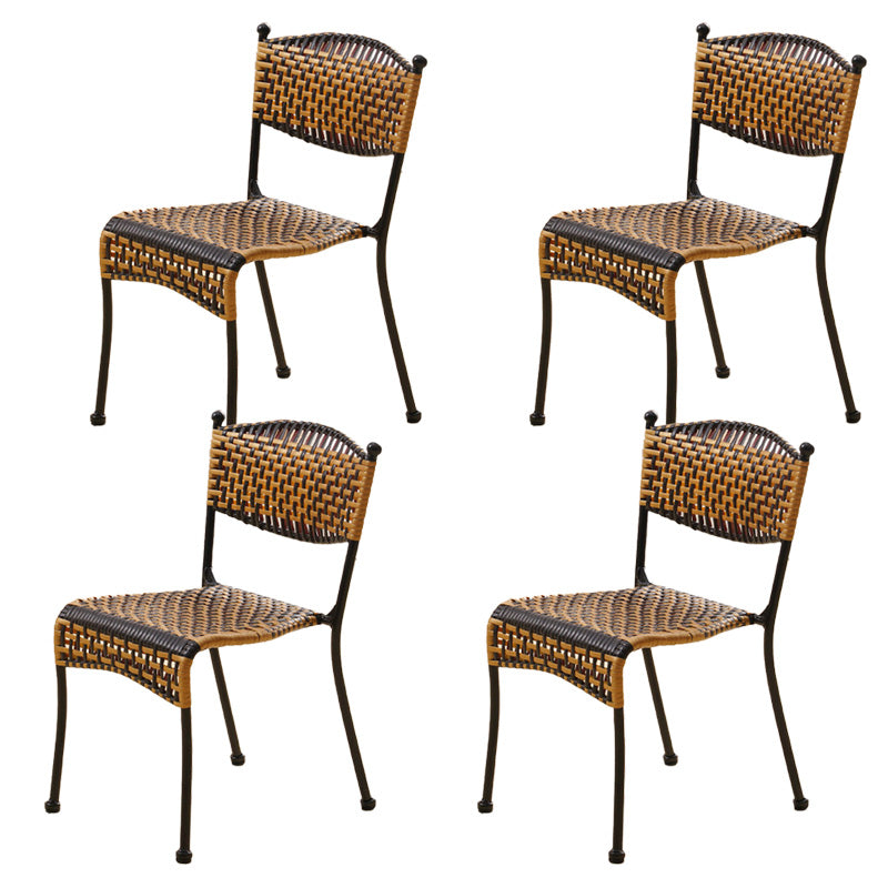 Tropical Dining Side Chair in Brown/Black Plastic with Open Back