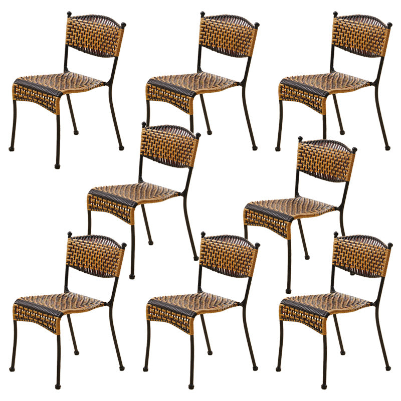 Tropical Dining Side Chair in Brown/Black Plastic with Open Back