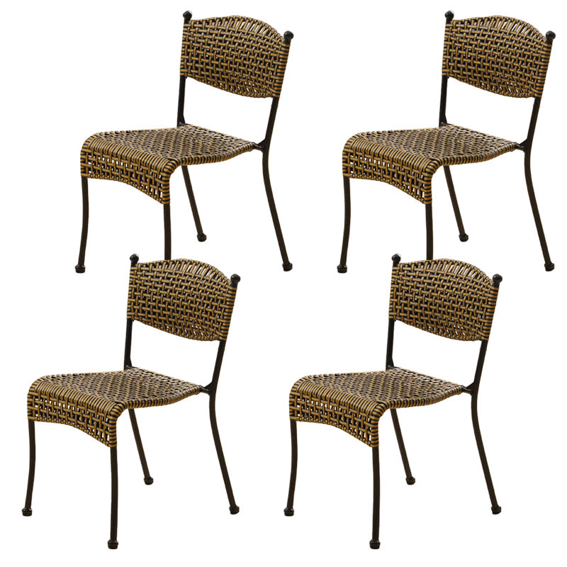 Tropical Dining Side Chair in Brown/Black Plastic with Open Back