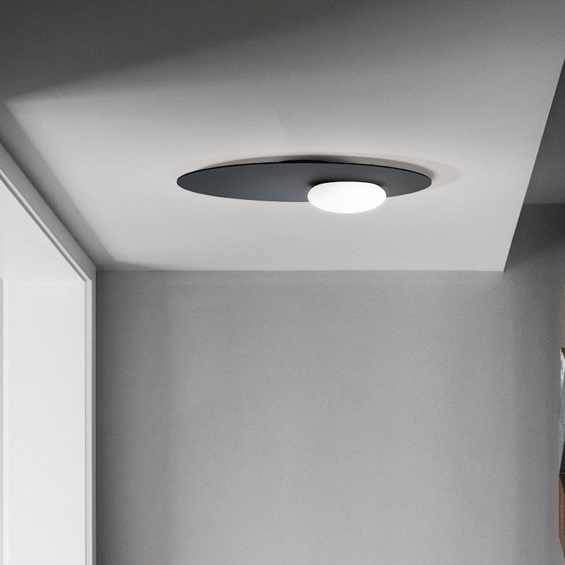 Cream Glass Ovoid Flush Mount Lamp Designer 1 Light Ceiling Lighting with Black / Brass Disk Top