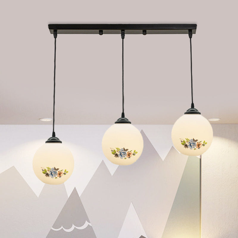 3 Heads Orb Multi-Pendant Modernism Black Finish White Frosted Glass Hanging Light Kit with Flower Pattern and Round/Linear Canopy