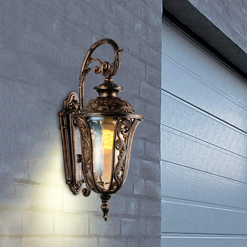 Sconce da parete a braccio curvo in metallo 1 lampada da parete all'aperto leggera in bronzo con tonalità di vetro ambra