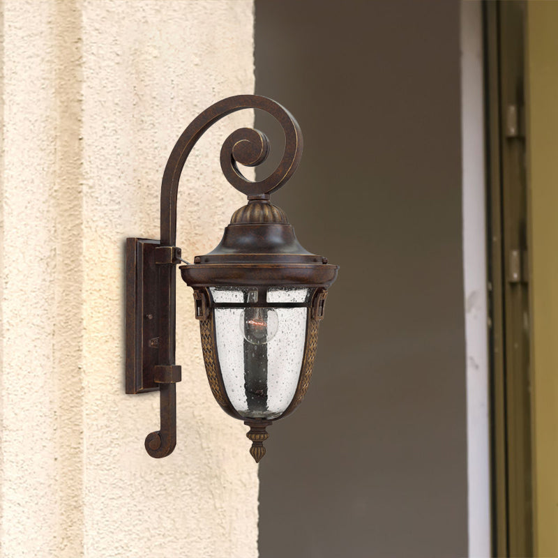 Scrolling Arm Metal Wall Lamp Rustic 1 Light Outdoor Sconce in Bronze with Seedy Glass Shade