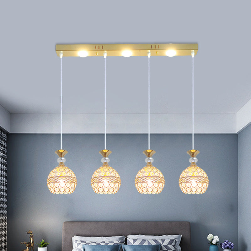 4 Köpfe Esszimmer Multi -Deckenleuchte modernistische Gold -Finish -Pendellampe mit Globuskristall eingebetteter Schatten